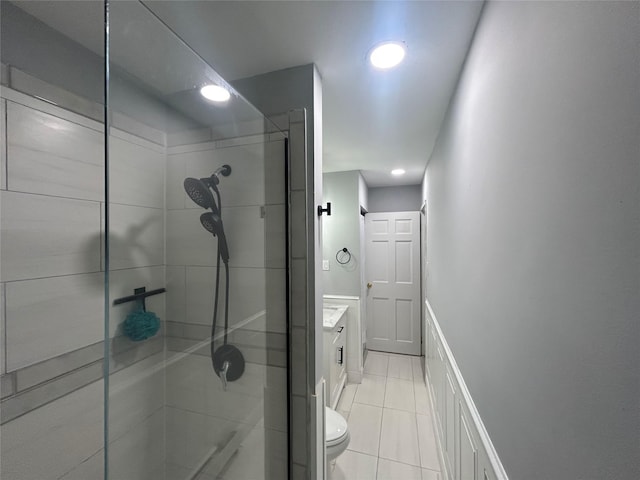 701 Towne House Vlg Unit 701, Hauppauge, NY 11749 - bathroom featuring vanity, tiled shower, tile patterned flooring, toilet, and recessed lighting
