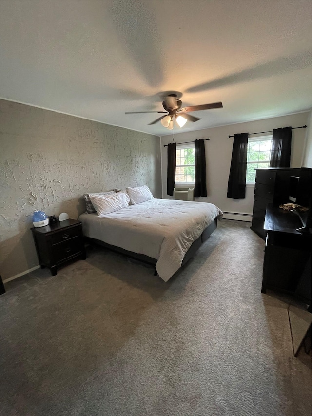 701 Towne House Vlg Unit 701, Hauppauge, NY 11749 - carpeted bedroom featuring baseboard heating, a textured ceiling, ceiling fan, and a textured wall