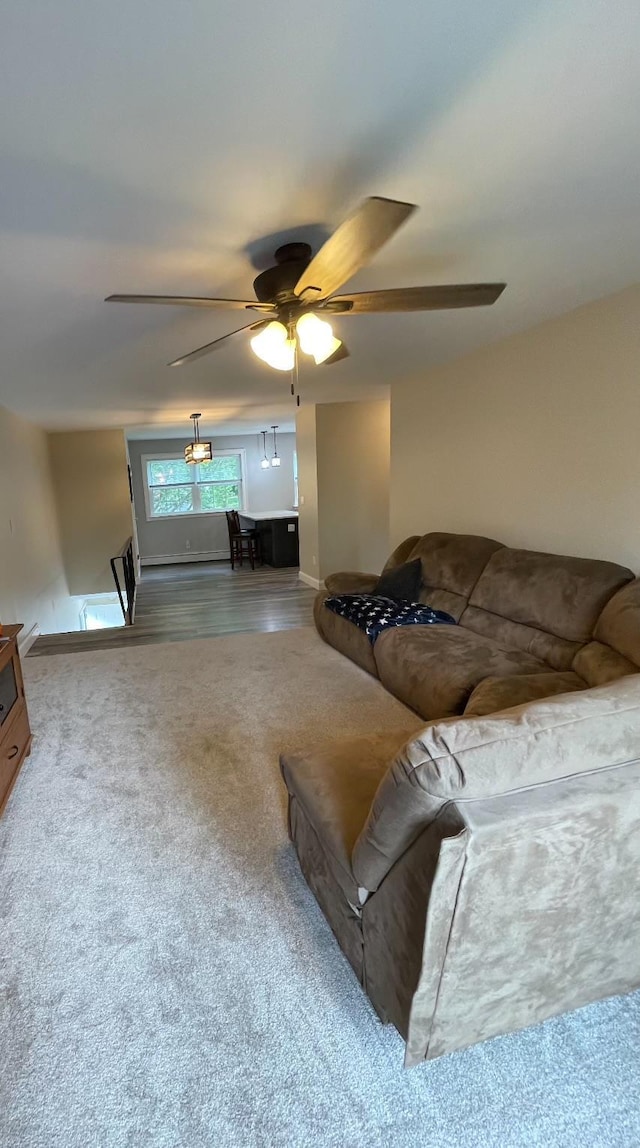 701 Towne House Vlg Unit 701, Hauppauge, NY 11749 - living area featuring ceiling fan, carpet, and baseboards