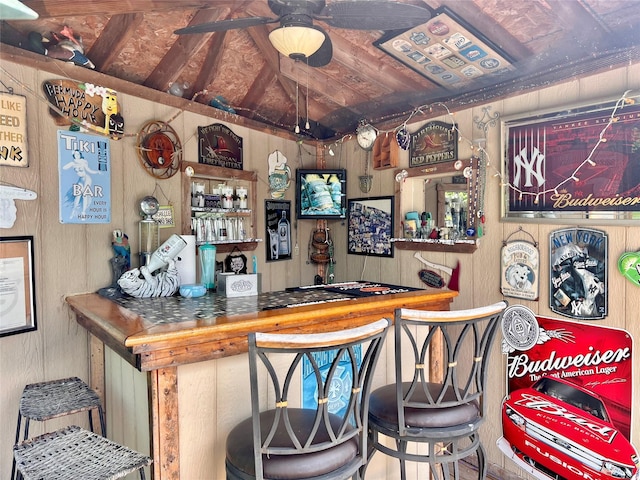 421 Orchard Dr, Wallkill, NY 12589 - bar area with wooden walls, lofted ceiling, and ceiling fan