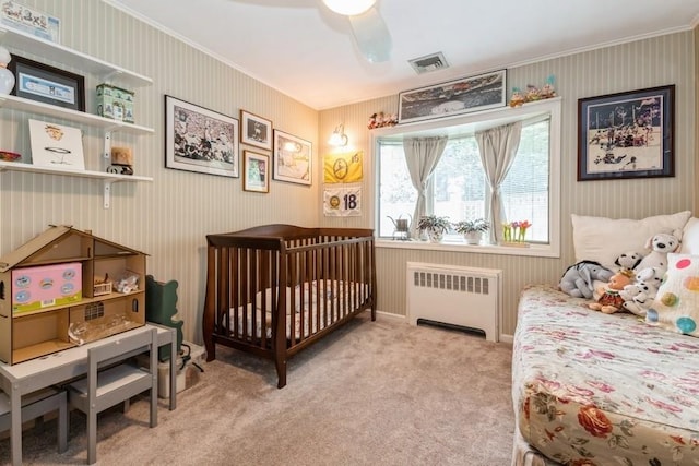 12 Hazel Pl, Woodmere, NY 11598 - bedroom with radiator, crown molding, carpet flooring, and a ceiling fan