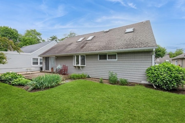 12 Hazel Pl, Woodmere, NY 11598 - back of house with roof with shingles, a yard, and a deck