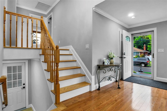 236 Martin Dr, Syosset, NY 11791 - entryway featuring hardwood / wood-style floors, baseboards, crown molding, and stairway