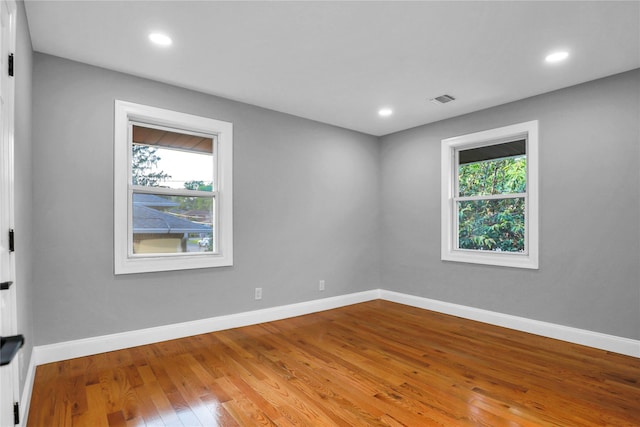 236 Martin Dr, Syosset, NY 11791 - spare room with plenty of natural light, baseboards, wood finished floors, and recessed lighting