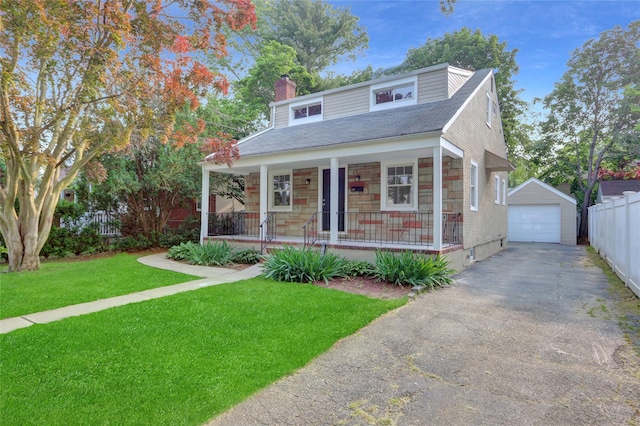 1459 Prince St, Baldwin, NY 11510 - bungalow with covered porch, asphalt driveway, a chimney, a garage, and an outbuilding