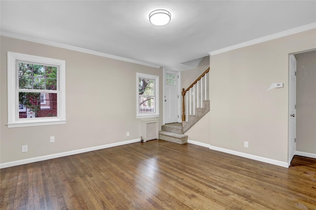 1459 Prince St, Baldwin, NY 11510 - unfurnished living room with plenty of natural light, wood finished floors, stairway, and crown molding