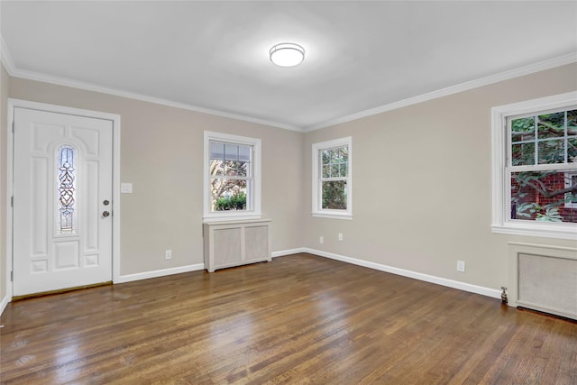 1459 Prince St, Baldwin, NY 11510 - entryway with wood finished floors, baseboards, crown molding, and radiator
