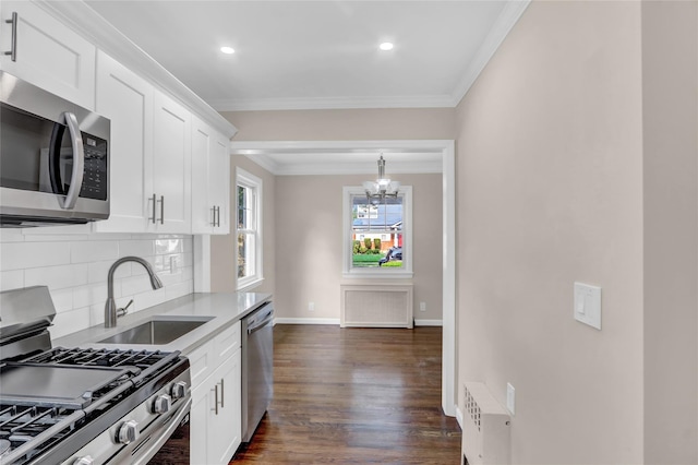 1459 Prince St, Baldwin, NY 11510 - kitchen with stainless steel appliances, a sink, decorative backsplash, dark wood-style flooring, and white cabinetry