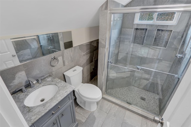 1459 Prince St, Baldwin, NY 11510 - full bath featuring toilet, vanity, tile walls, and a stall shower