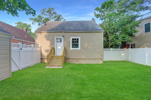 1459 Prince St, Baldwin, NY 11510 - back of property with entry steps, brick siding, and a shingled roof