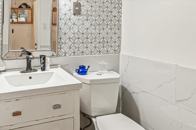 1655 Flatbush Ave Unit A1102, Brooklyn, NY 11210 - bathroom featuring toilet, vanity, and tile walls