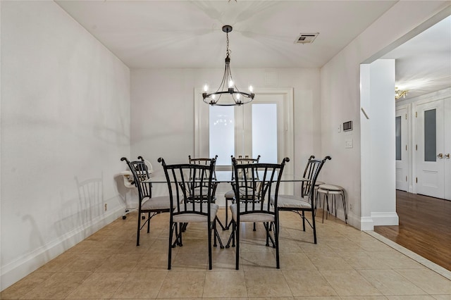 218 Middleton St Unit Apt6Rooftop, Brooklyn, NY 11206 - dining room featuring a chandelier, light tile patterned flooring, and baseboards