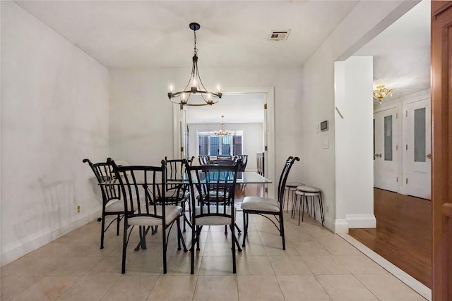 218 Middleton St Unit Apt6Rooftop, Brooklyn, NY 11206 - dining space featuring a chandelier, baseboards, and light tile patterned floors