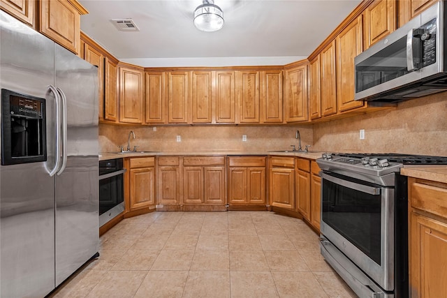 218 Middleton St Unit Apt6Rooftop, Brooklyn, NY 11206 - kitchen with appliances with stainless steel finishes, decorative backsplash, light countertops, and a sink