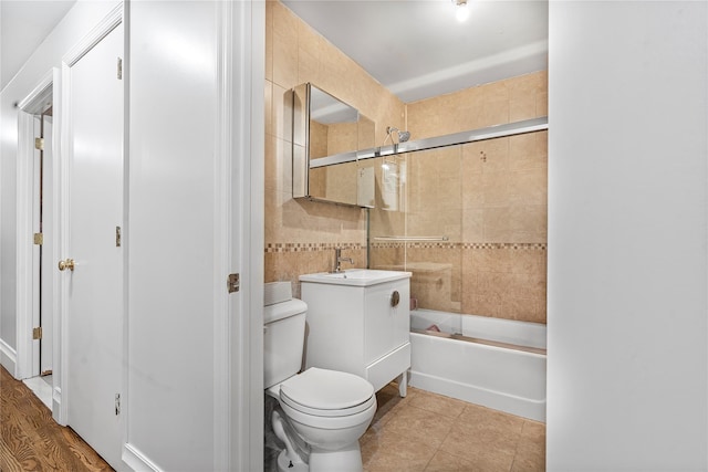 218 Middleton St Unit Apt6Rooftop, Brooklyn, NY 11206 - bathroom with toilet, vanity, shower / bath combination with glass door, tile walls, and tile patterned flooring