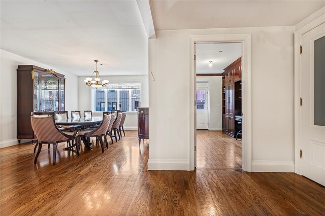 218 Middleton St Unit Apt6Rooftop, Brooklyn, NY 11206 - dining room featuring a chandelier, baseboards, and wood finished floors