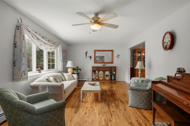 16 Shipley Dr, Cortlandt Manor, NY 10567 - living area featuring baseboard heating, ceiling fan, light wood-type flooring, and a baseboard heating unit