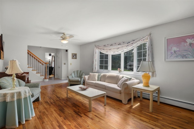 16 Shipley Dr, Cortlandt Manor, NY 10567 - living room with stairway, hardwood / wood-style floors, a ceiling fan, and a baseboard heating unit