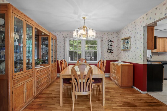 16 Shipley Dr, Cortlandt Manor, NY 10567 - dining area with wallpapered walls, a chandelier, light wood-style flooring, and a baseboard heating unit