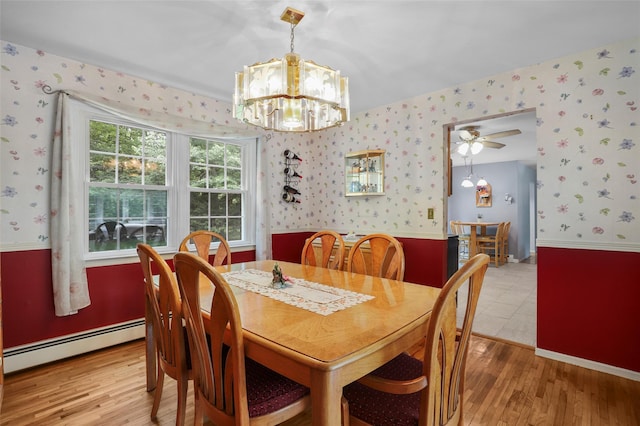 16 Shipley Dr, Cortlandt Manor, NY 10567 - dining area with a baseboard radiator, wallpapered walls, light wood-style flooring, a chandelier, and a wainscoted wall