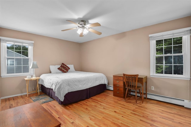 16 Shipley Dr, Cortlandt Manor, NY 10567 - bedroom featuring wood finished floors, baseboard heating, and a ceiling fan