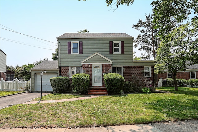 99 Roosevelt Ct, Carle Place, NY 11514 - colonial-style house featuring asphalt driveway, brick siding, and an attached garage