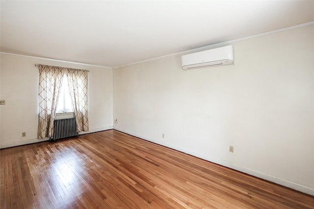 99 Roosevelt Ct, Carle Place, NY 11514 - unfurnished room featuring an AC wall unit, radiator, hardwood / wood-style floors, ornamental molding, and baseboards