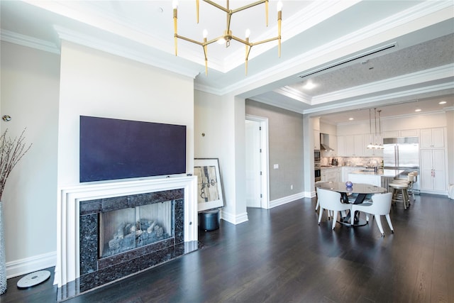1000 Royal Ct Unit 1306, North Hills, NY 11040 - dining room with a chandelier, dark wood-type flooring, ornamental molding, a premium fireplace, and baseboards