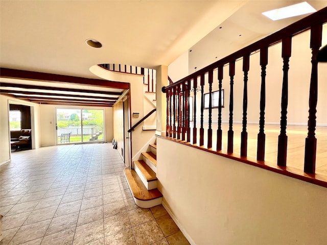 636 Derby Ave, Woodmere, NY 11598 - stairway with baseboards and a skylight