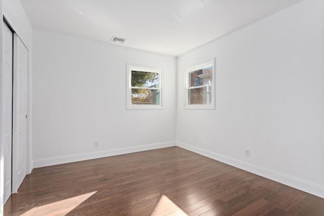 78 Jesse St, Freeport, NY 11520 - unfurnished bedroom featuring hardwood / wood-style flooring, baseboards, and a closet