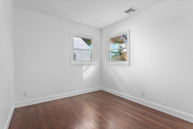 78 Jesse St, Freeport, NY 11520 - spare room featuring dark wood-style floors and baseboards