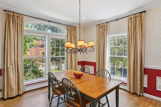 1771 Hanover St, Yorktown Heights, NY 10598 - dining area with wallpapered walls, wood finished floors, plenty of natural light, a chandelier, and ornamental molding
