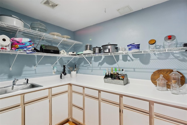 1771 Hanover St, Yorktown Heights, NY 10598 - kitchen featuring light countertops and white cabinetry
