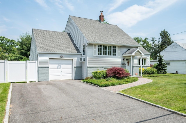 6 Plumtree Ln, South Huntington, NY 11746 - view of front of house with a garage, a chimney, asphalt driveway, and brick siding