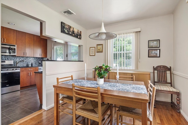 6 Plumtree Ln, South Huntington, NY 11746 - dining space with dark wood finished floors and ornamental molding