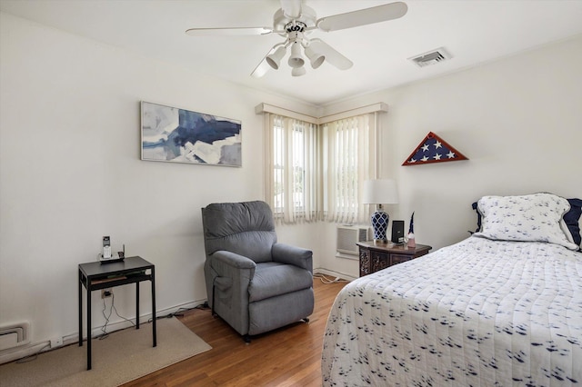6 Plumtree Ln, South Huntington, NY 11746 - bedroom featuring wood finished floors, a wall mounted air conditioner, and ceiling fan