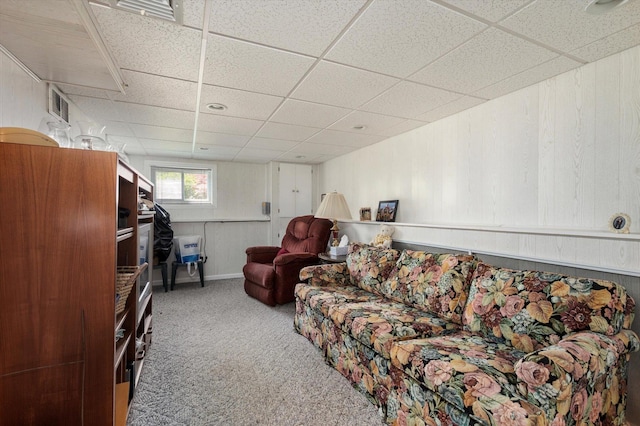 6 Plumtree Ln, South Huntington, NY 11746 - carpeted living area featuring a drop ceiling and wood walls
