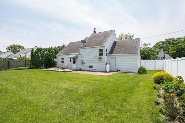6 Plumtree Ln, South Huntington, NY 11746 - back of property featuring a patio, a gate, a shingled roof, and a chimney