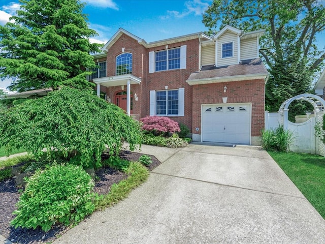 1674 Birch Dr, Merrick, NY 11566 - view of front facade with an attached garage, concrete driveway, and brick siding