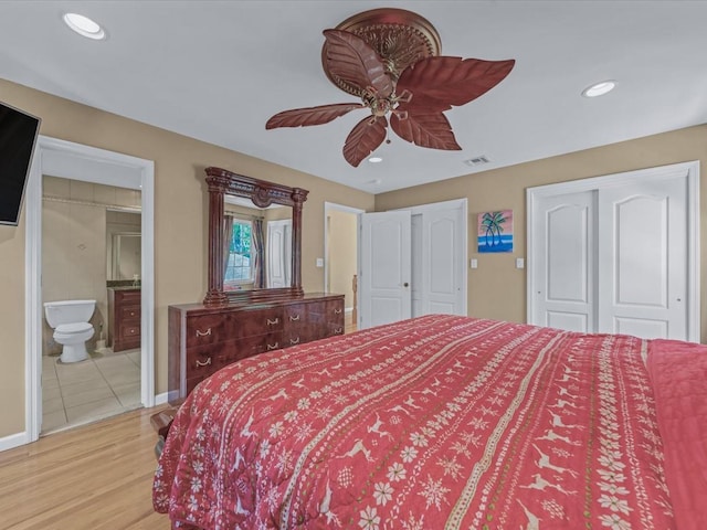 1674 Birch Dr, Merrick, NY 11566 - bedroom with multiple closets, light wood-type flooring, connected bathroom, recessed lighting, and ceiling fan
