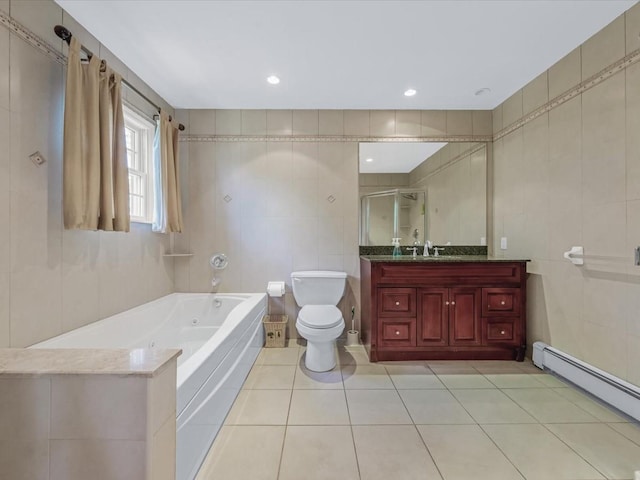 1674 Birch Dr, Merrick, NY 11566 - full bath with tile walls, a baseboard heating unit, a tub with jets, tile patterned flooring, and vanity