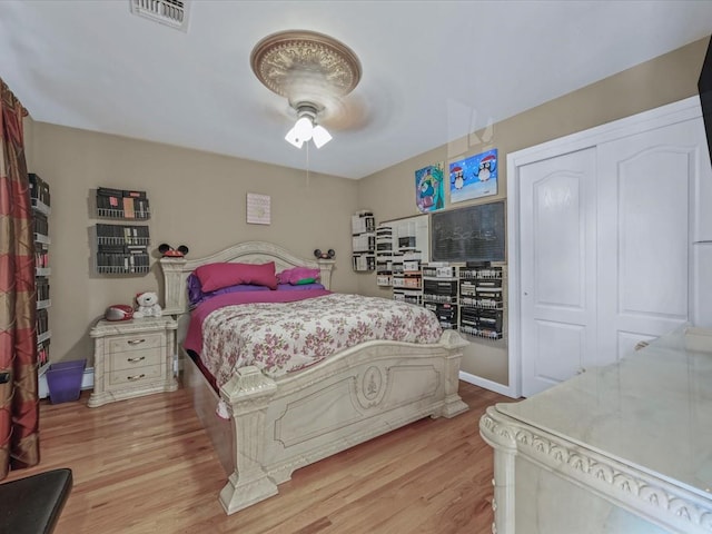 1674 Birch Dr, Merrick, NY 11566 - bedroom featuring light wood-type flooring, a ceiling fan, and a closet