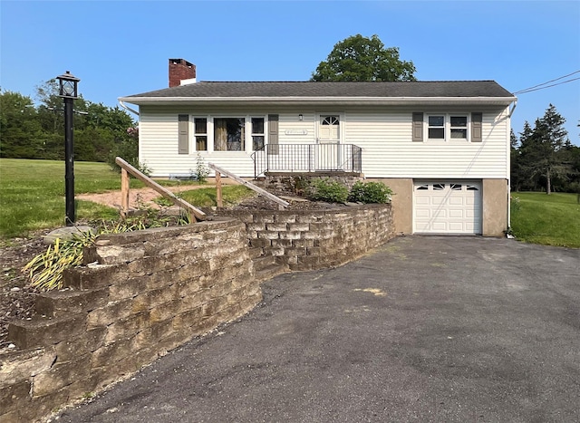 74 E Ridge Rd, Warwick, NY 10990 - single story home with driveway, a chimney, a garage, and a front yard