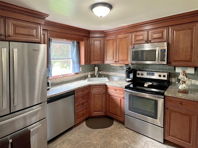 74 E Ridge Rd, Warwick, NY 10990 - kitchen featuring appliances with stainless steel finishes, a sink, and brown cabinetry
