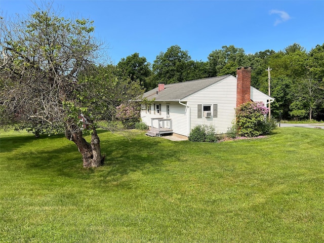 74 E Ridge Rd, Warwick, NY 10990 - rear view of property with a chimney and a lawn
