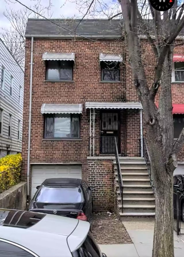 4027 Gunther Ave, Bronx, NY 10466 - view of front of house featuring brick siding and a garage