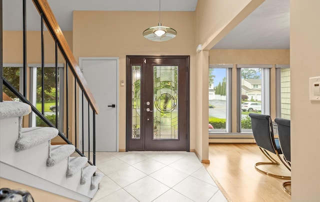 34 Oak Meadow Rd, Commack, NY 11725 - entryway with stairs, plenty of natural light, and wood finished floors