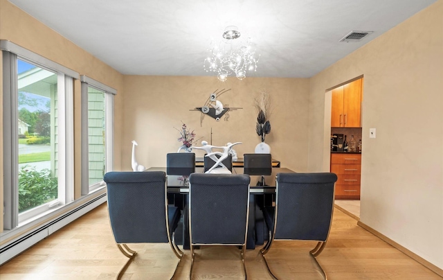 34 Oak Meadow Rd, Commack, NY 11725 - dining area with a baseboard radiator, light wood-style floors, plenty of natural light, and a chandelier