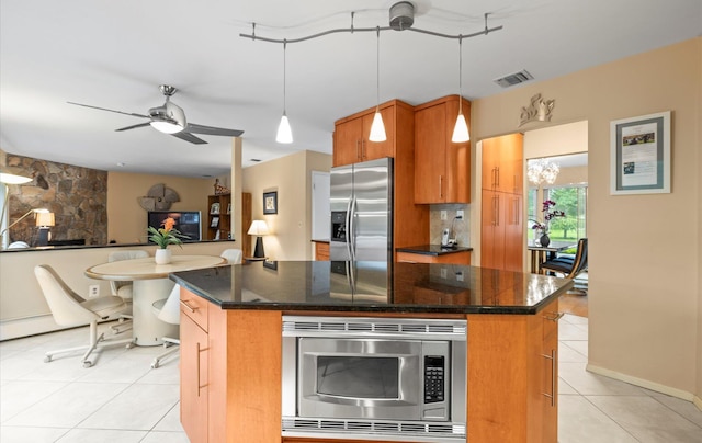 34 Oak Meadow Rd, Commack, NY 11725 - kitchen with stainless steel appliances, a ceiling fan, tasteful backsplash, a center island, and light tile patterned floors