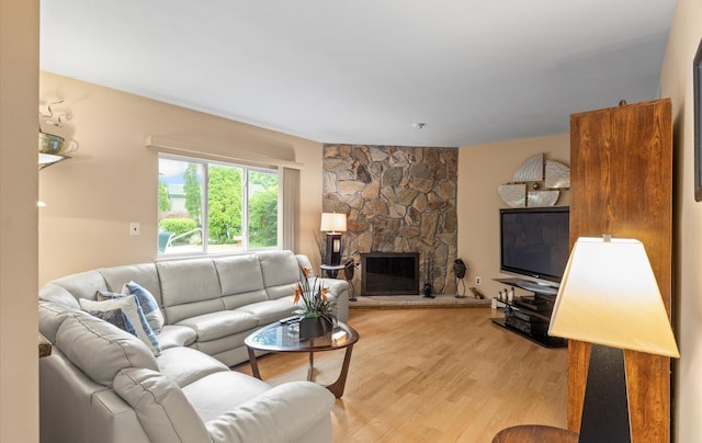 34 Oak Meadow Rd, Commack, NY 11725 - living room featuring light wood-type flooring and a fireplace